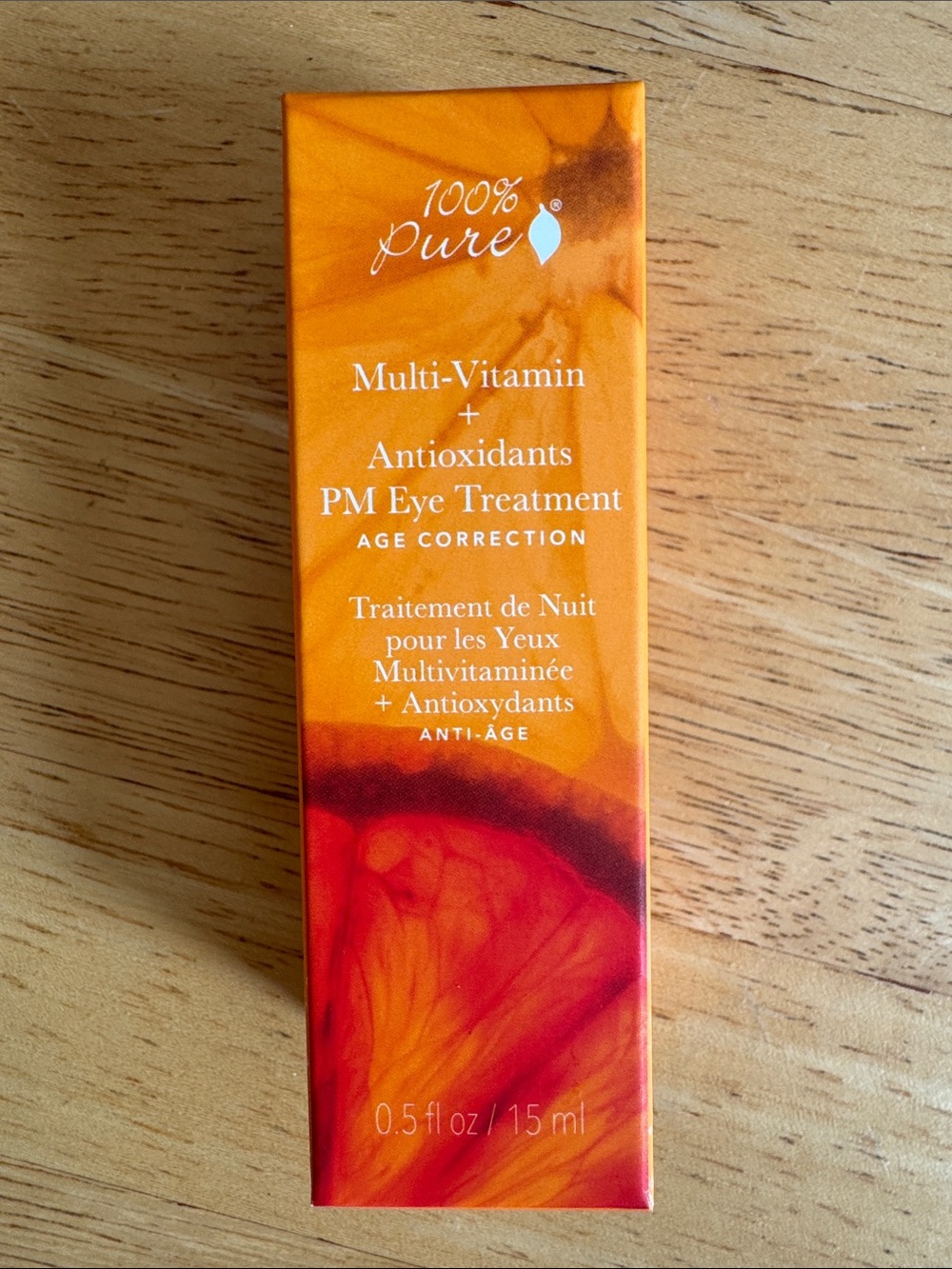 100% Pure PM Eye Treatment - Orange and Red Packaging